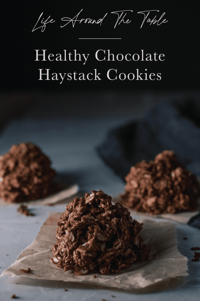 pinterest pin for that says healthy chocolate haystack cookies over a photo of 3 cookies on sheets of parchment paper. 