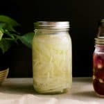 finished product of the fermented onions in a mason jar on a counter top