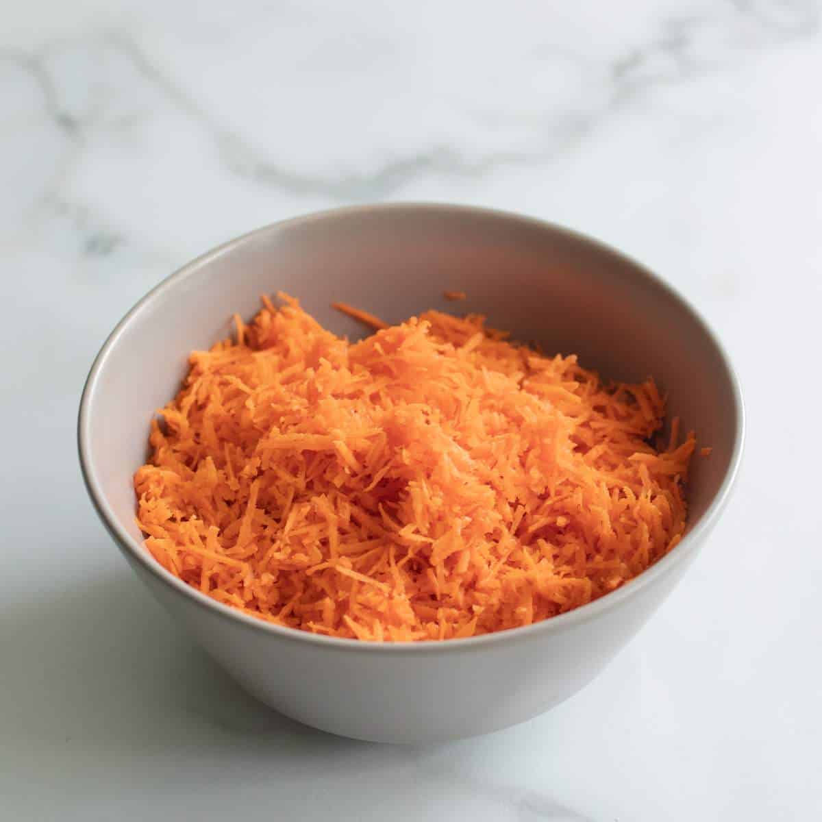 Grated carrot in a bowl.