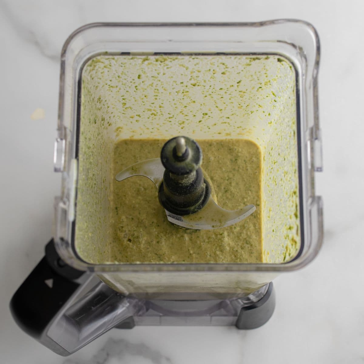 Blended coconut oil, coconut sugar, spinach, buttermilk, eggs and lemon zest in a blender container.