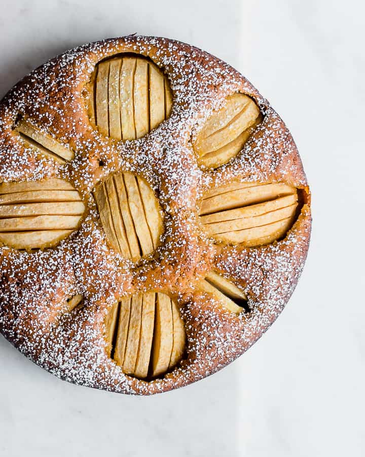 Apple cake with white, powdered sugar on top.